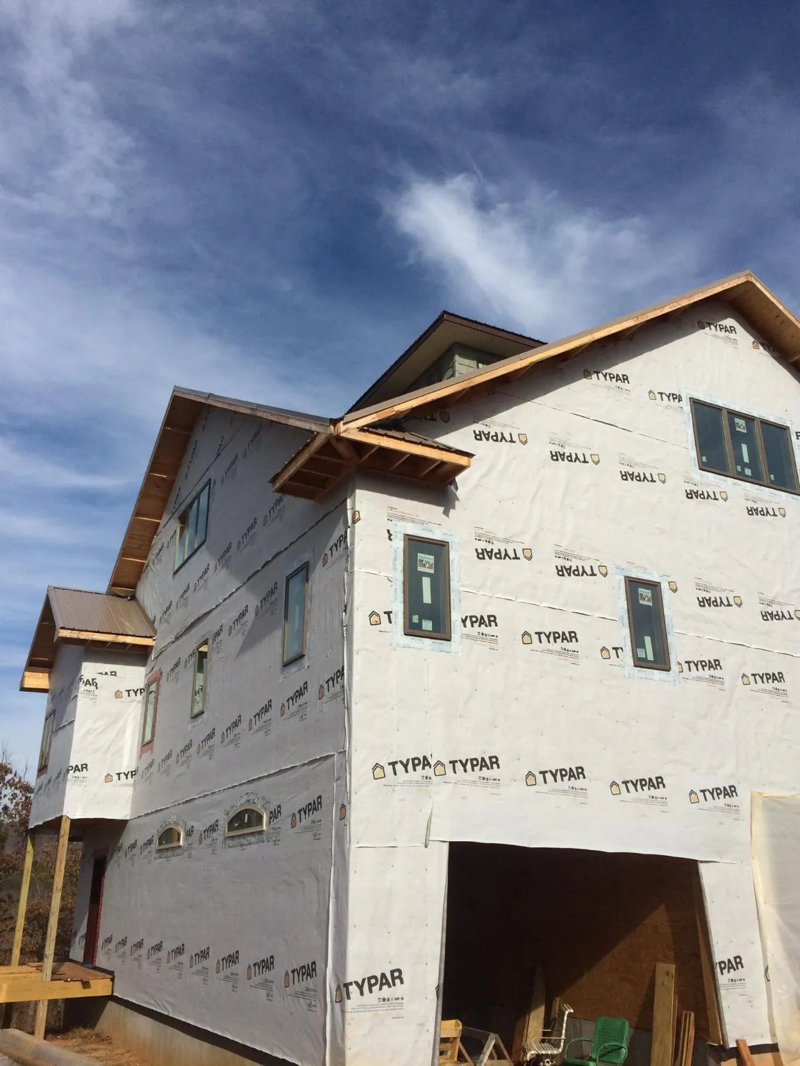 Stick built house wrapped in Typar with new roof framing and dormers in Churchton